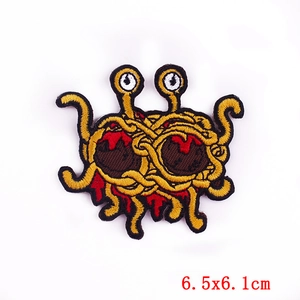 Macro detail of Flying Spaghetti Monster embroidered patch showing 6.5x6.1cm dimensions
