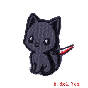 Detail of dark grey cat cartoon embroidery patch with knife design, size 5.8x4.7cm