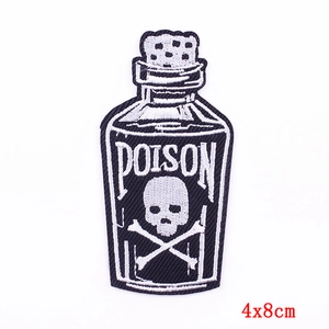 Detailed view of skull poison bottle embroidery patch with 4x8cm size dimensions