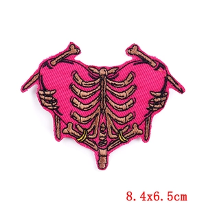 Detailed embroidery patch of a human rib cage on magenta heart background 8.4x6.5cm