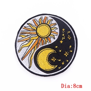 Close-up of 8cm circular Yin Yang embroidery patch with sun, moon, and stars details