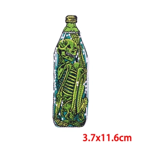 Skull embroidery patch in a glass bottle shape for ironing, sized 3.7x11.6cm for DIY crafts