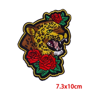Detailed embroidery patch featuring a leopard head with red roses, size 7.3x10cm