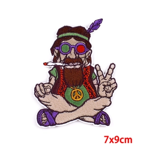 Detailed embroidery patch showing a hippie old man with peace sign and sunglasses