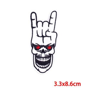 Detail showing skull rock gesture embroidered patch with size dimensions 3.3x8.6cm