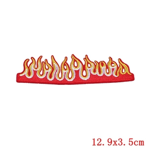 Detailed close-up of a red flame embroidery patch with white and yellow stitching detail