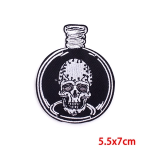 Macro detail of dark punk skull embroidery patch in glass bottle style 5.5x7cm size