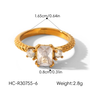 Close-up of gold-plated stainless steel ring with zircon stone and size annotations.