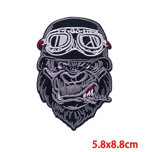 Detailed view of punk style gorilla embroidery patch with goggles measuring 5.8x8.8cm