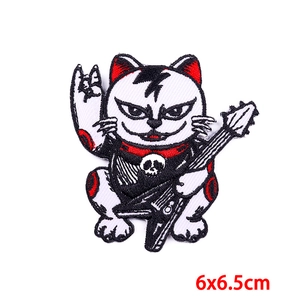 Punk rock cat embroidered patch with electric guitar and skull motif, size 6x6.5cm