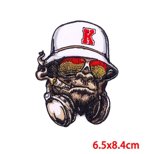 Macro detail of gorilla embroidery patch with street style sunglasses and headphones