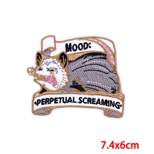 Embroidered opossum patch with Mood Perpetual Screaming text for DIY iron-on apparel