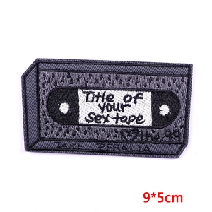 Detailed embroidery patch showing retro tape design and Brooklyn Nine-Nine text