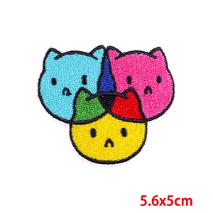 Detail showing colorful cat embroidery patches with fine stitching in 5.6x5cm size