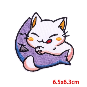 Detail of cartoon white cat and purple fish embroidery patch for clothing DIY