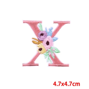 Close-up of letter X embroidery patch with colorful floral design 4.7x4.7cm size