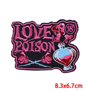 Detailed embroidery patch with Love Poison text and red roses, measuring 8.3x6.7cm