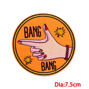 Orange cartoon embroidered patch featuring Bang Bang hand gesture and 7.5cm diameter