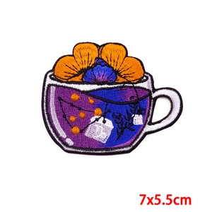 Embroidered punk coffee cup patch with purple liquid and orange flowers, 7x5.5cm size