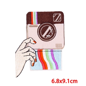 Macro view of vintage camera embroidery patch with rainbow detail and 6.8x9.1cm dimensions