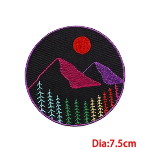 7.5cm round embroidered patch with purple mountains and colorful sunset landscape