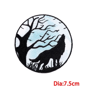 7.5cm round silhouette embroidery patch featuring a black wolf howling under the moonlight