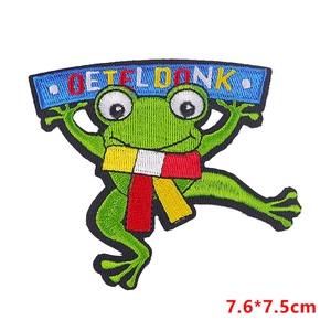 Macro detail of Oeteldonk frog patch with fine embroidery for Carnival DIY costumes