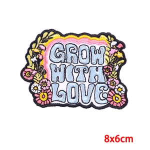 Embroidered bohemian flower patch with Grow With Love text in size 8x6cm