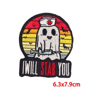 Detail of ghost nurse embroidery patch with I Will Stab You text and bat silhouette
