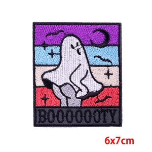 Detail showing 6x7cm funny ghost embroidery patch with colorful stripes and BOOOOOTY text
