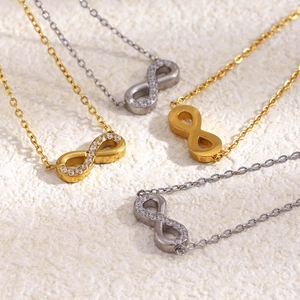 Detailed view of infinity symbol necklaces in gold and silver with zircon accents