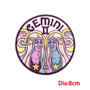 Detailed macro view of 8cm Gemini zodiac embroidered patch with fine stitching