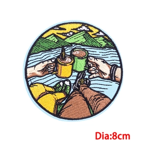 8cm round embroidered patch featuring outdoor camping scene with mountains and lake