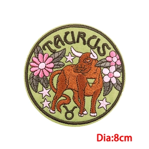 8cm Taurus zodiac embroidery patch with orange bull and pink flowers on green fabric