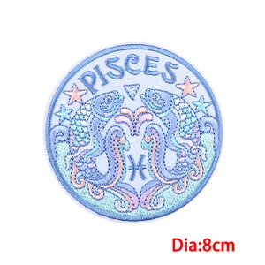 Detailed embroidery of 8cm circular Pisces zodiac patch with blue and purple thread