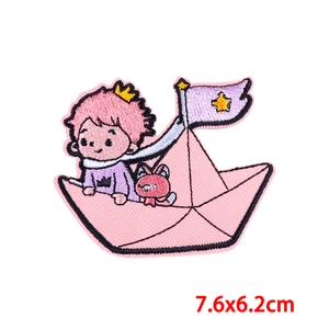 Detail of cartoon boy on paper boat embroidery patch with kitten, size 7.6x6.2cm