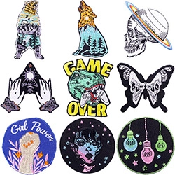 Collection of 9 embroidered patches featuring animals, planets, and girl power slogans