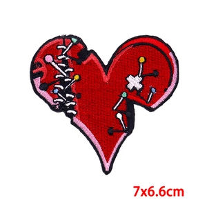 Punk style red heart embroidered patch with stitch details and needles, 7x6.6cm size