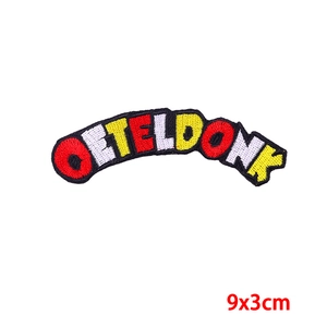 Detailed embroidery patch with Oeteldonk text in red white and yellow 9x3cm size