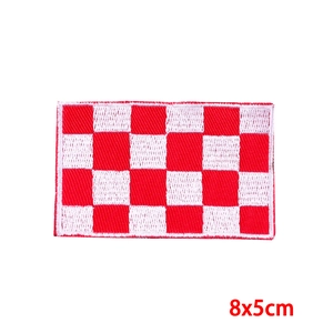 Close-up of red and white checkered Oeteldonk embroidery patch measuring 8x5cm
