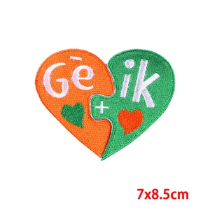 Detail of 7x8.5cm heart-shaped puzzle embroidery patch with colorful letters
