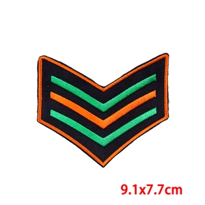 Detail of V-shaped chevron embroidery patch in green and orange, size 9.1x7.7cm