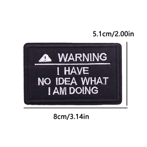 Close-up of embroidered tactical patch with funny warning text and size measurement