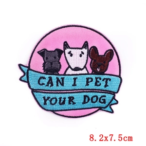 Embroidered iron-on patch with cartoon dogs and Can I Pet Your Dog blue ribbon text
