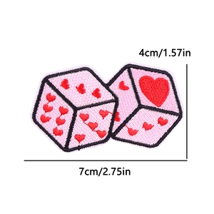 Detailed view of pink dice embroidery patch with red heart pattern and size measurements