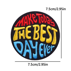 Detailed close-up of 7.5cm round embroidered patch with Make Today The Best Day slogan