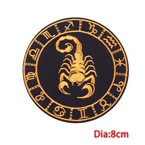 Detailed 8cm Scorpio zodiac embroidery patch with gold metallic thread on black background