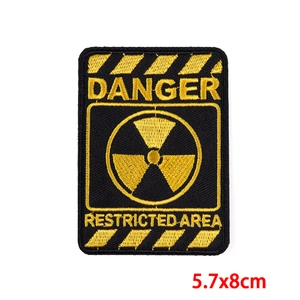 Detailed embroidery patch with Danger Radioactive Restricted Area warning symbol in yellow