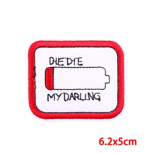 Detail of 6.2x5cm embroidered battery patch with Die Die My Darling text and red border