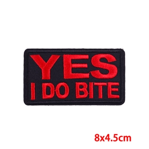 Custom embroidered patch with 'YES I DO BITE' red lettering on black background 8x4.5cm